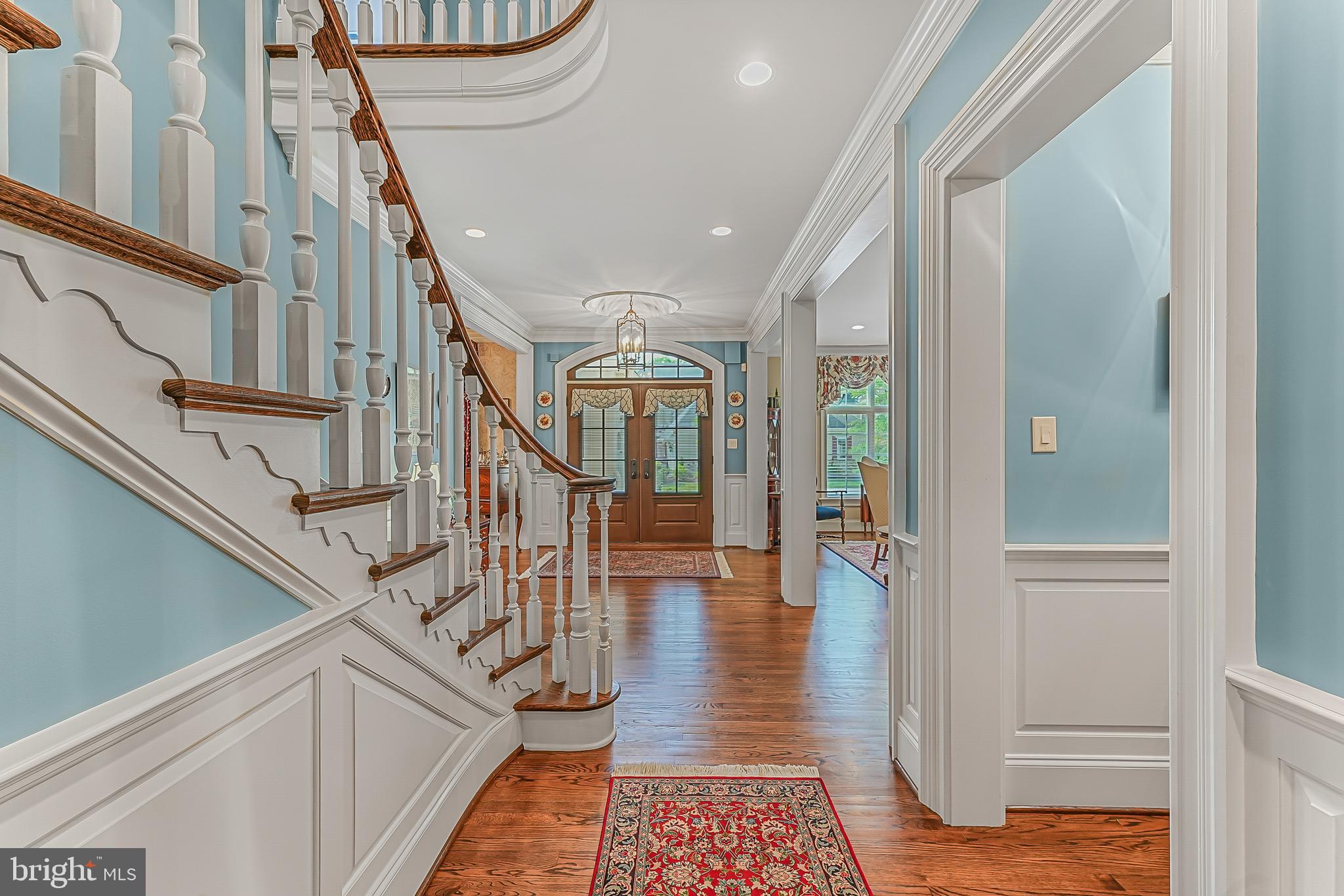 217 Valley Ridge Road Haverford, PA 19041 - Photo 4 of 49 a hallway with wooden floor windows and stairs