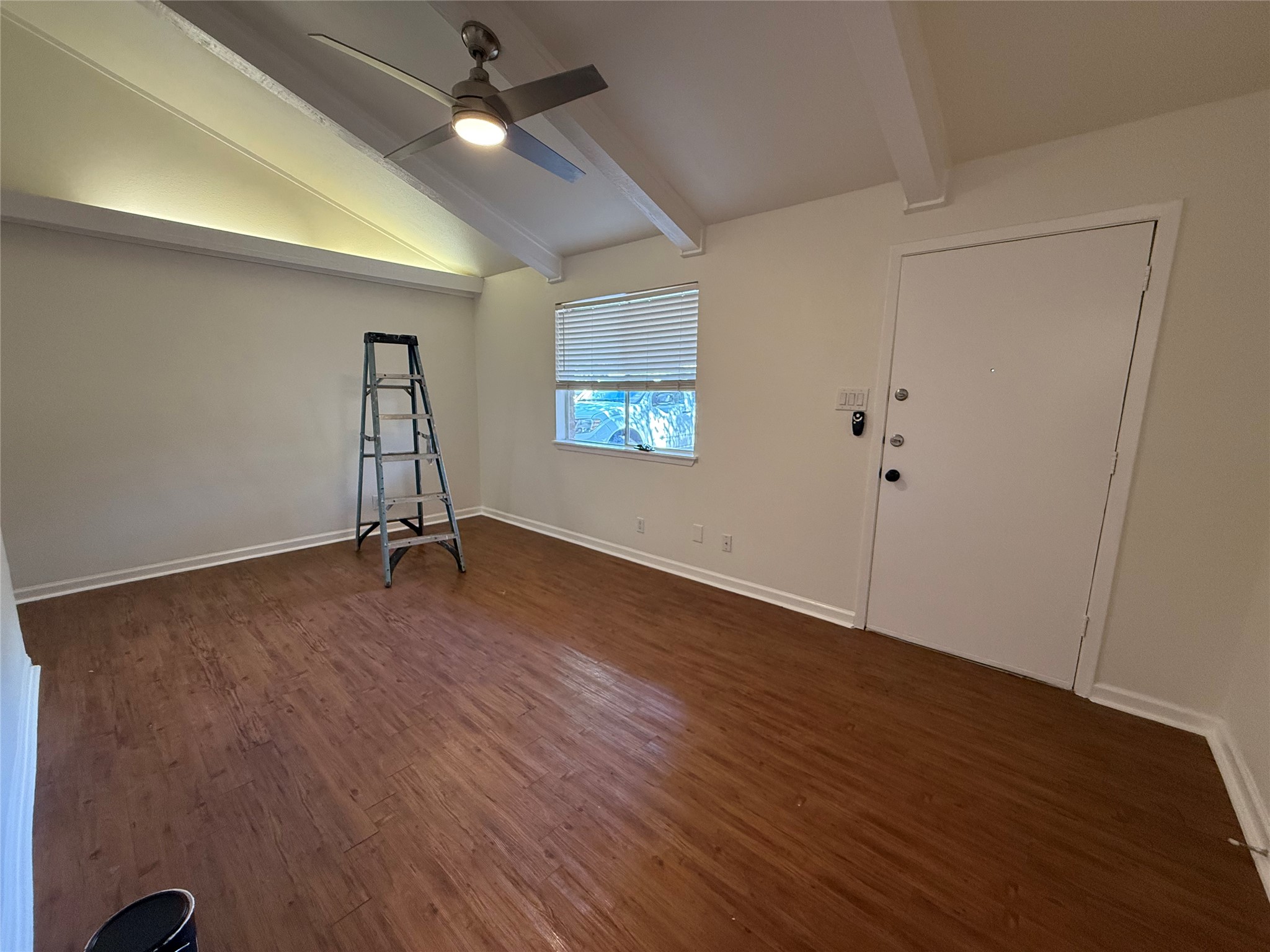 6710 Circle S Road, Unit B Austin, TX 78745 - Photo 4 of 14 an empty room with wooden floor and windows
