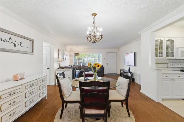 a kitchen with stainless steel appliances a sink a stove and a refrigerator