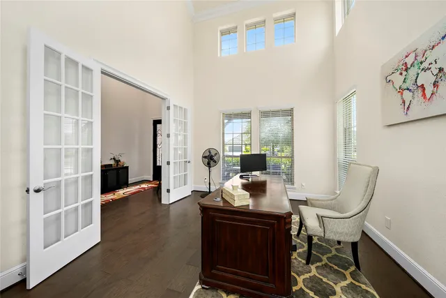 a view of a dining room with furniture and window