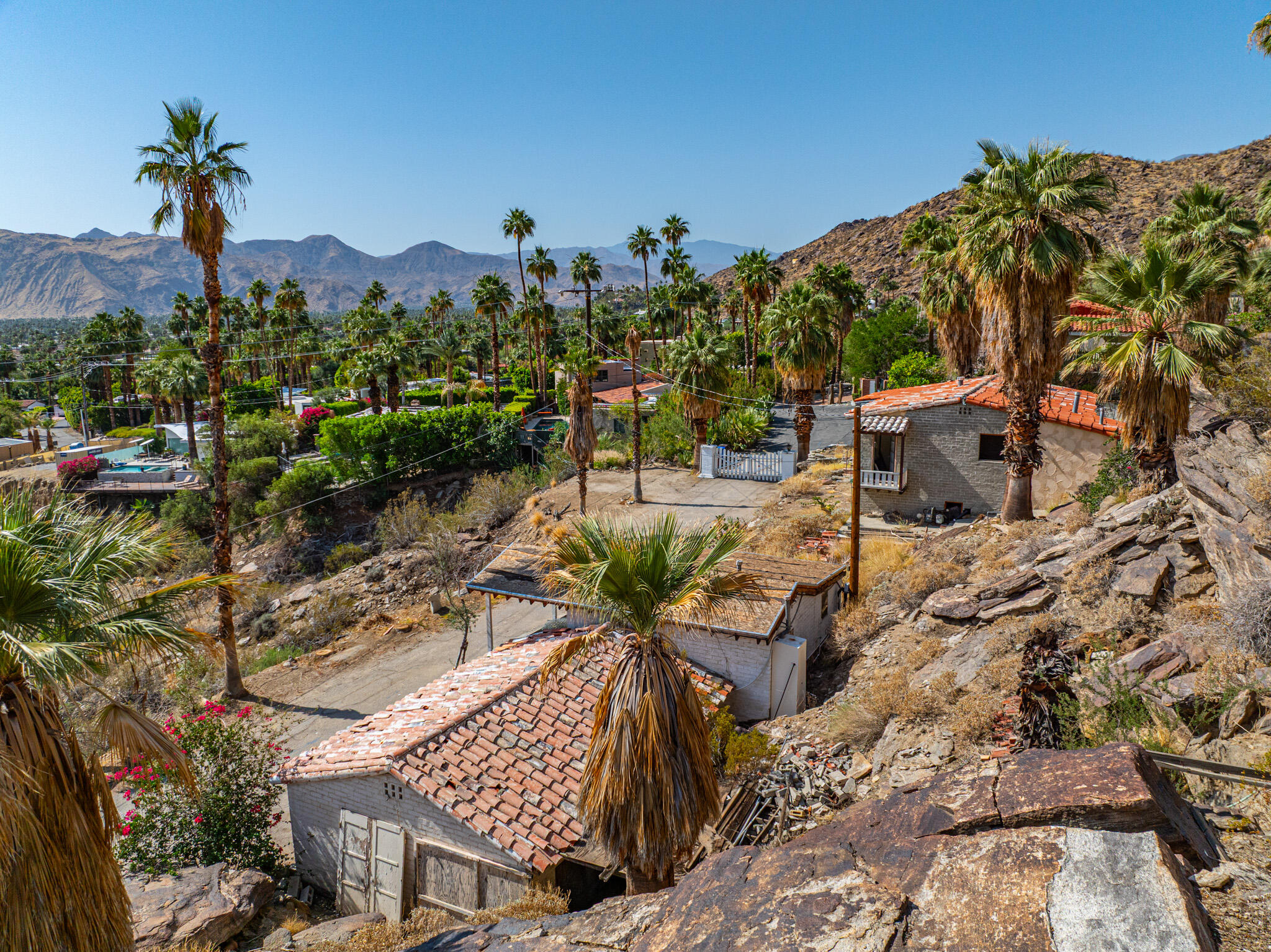 1716 Ridge Road Palm Springs, CA 92264 - Photo 14 of 37 a view of a chairs and table on the terrace
