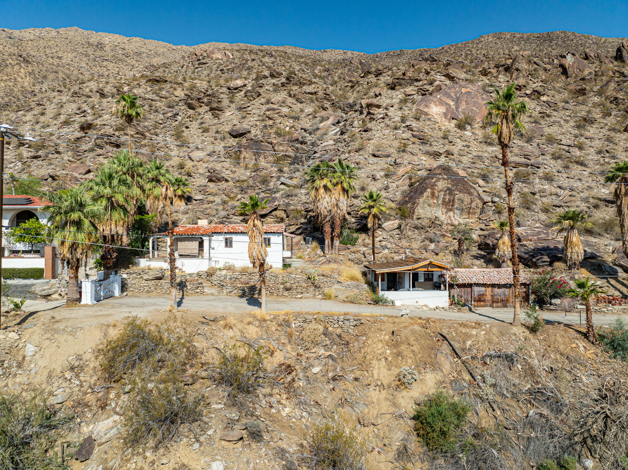 1716 Ridge Road Palm Springs, CA 92264 - Photo 4 of 37 a view of a backyard with large trees