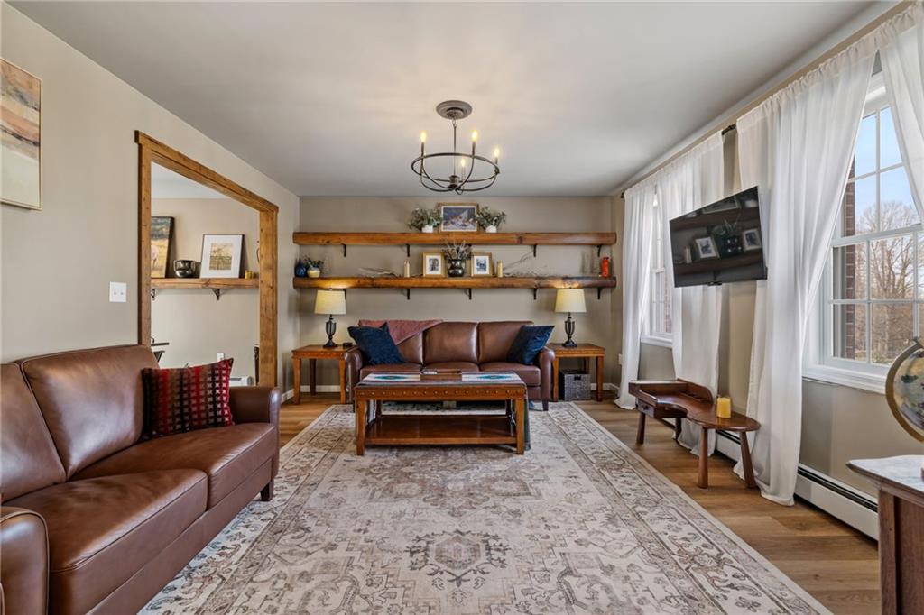 147 Fike Lane Addison, PA 15411 - Photo 22 of 50 a living room with furniture a flat screen tv and a table