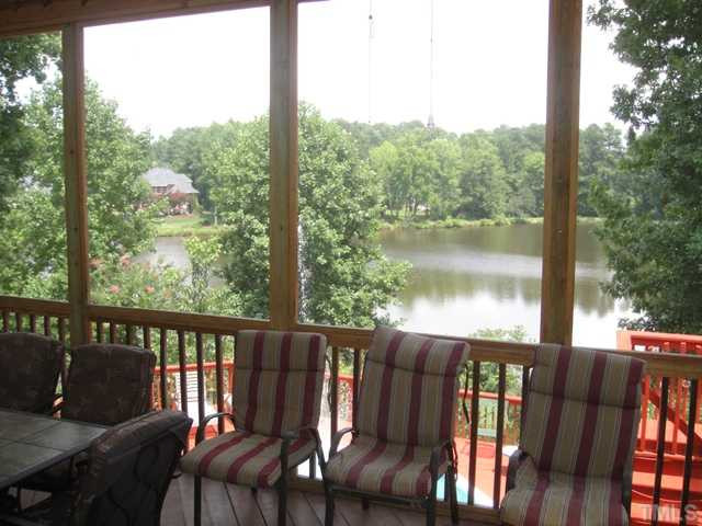 2704 Blue Ravine Road Wake Forest, NC 27587 - Photo 19 of 25 Screened Porch Overlooking Lake!