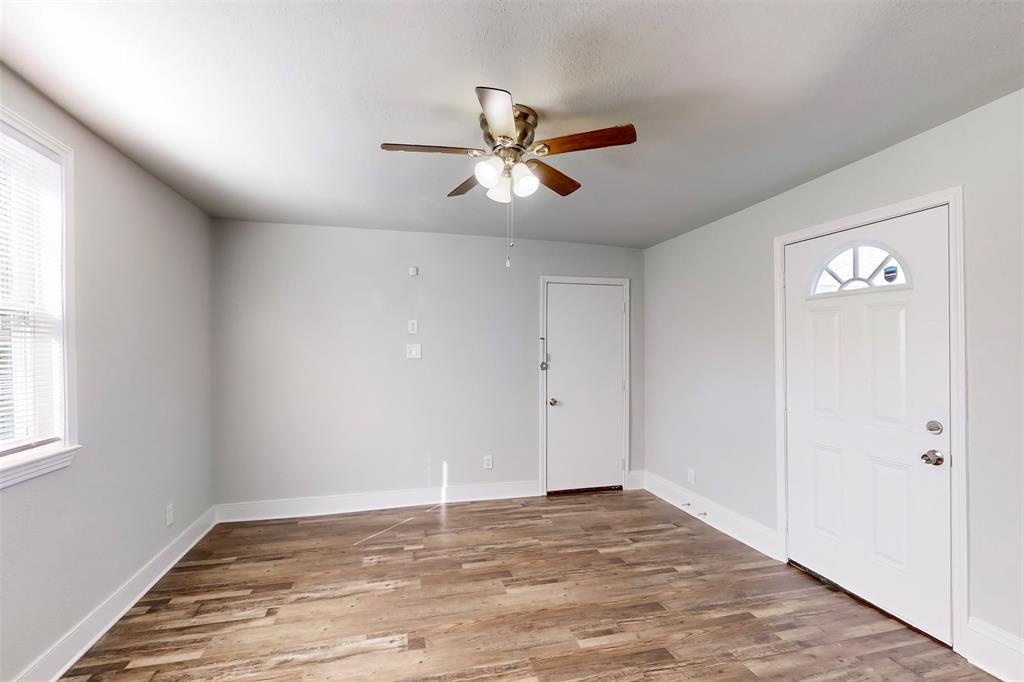 2667 Custer Drive Dallas, TX 75216 - Photo 14 of 33 a view of empty room with wooden floor and fan