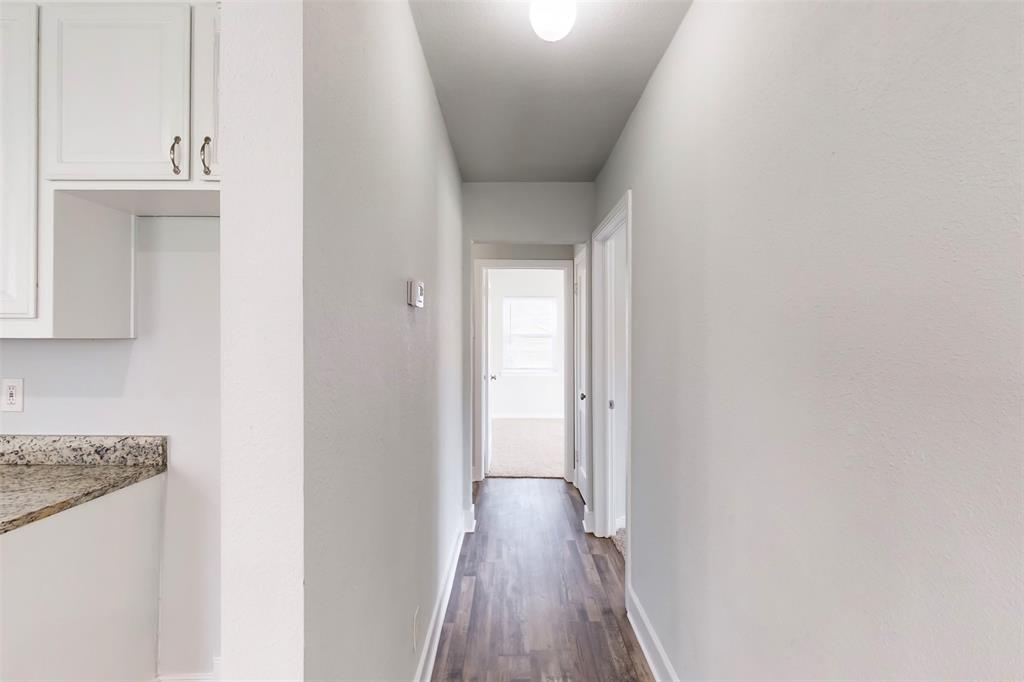 2667 Custer Drive Dallas, TX 75216 - Photo 18 of 33 a view of a hallway with wooden floor