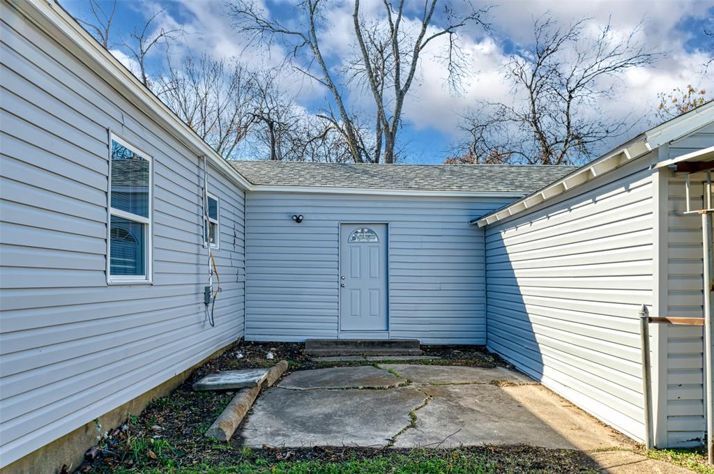 2667 Custer Drive Dallas, TX 75216 - Photo 28 of 33 a view of a house with a yard