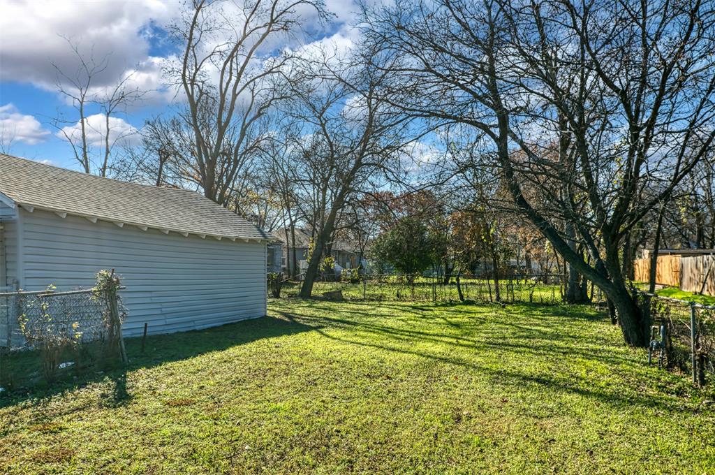 2667 Custer Drive Dallas, TX 75216 - Photo 30 of 33 a view of a backyard with large trees