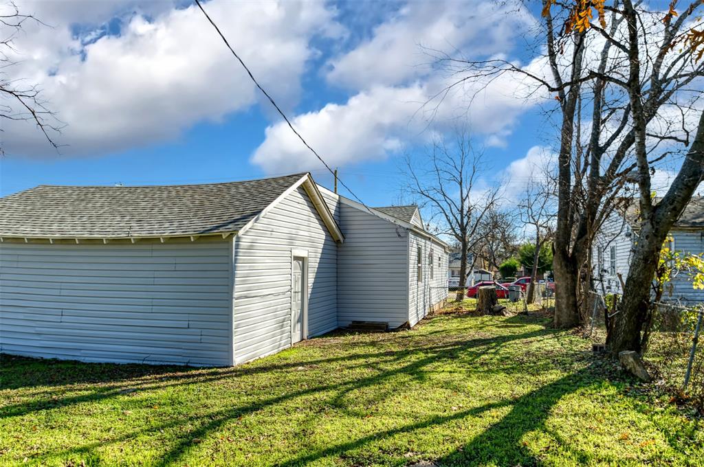 2667 Custer Drive Dallas, TX 75216 - Photo 32 of 33 a view of a backyard with a large tree
