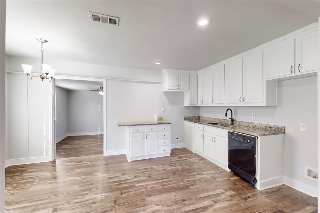 2667 Custer Drive Dallas, TX 75216 - Photo 9 of 33 a kitchen with a stove a sink and a refrigerator
