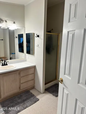 a bathroom with a double vanity sink and mirror