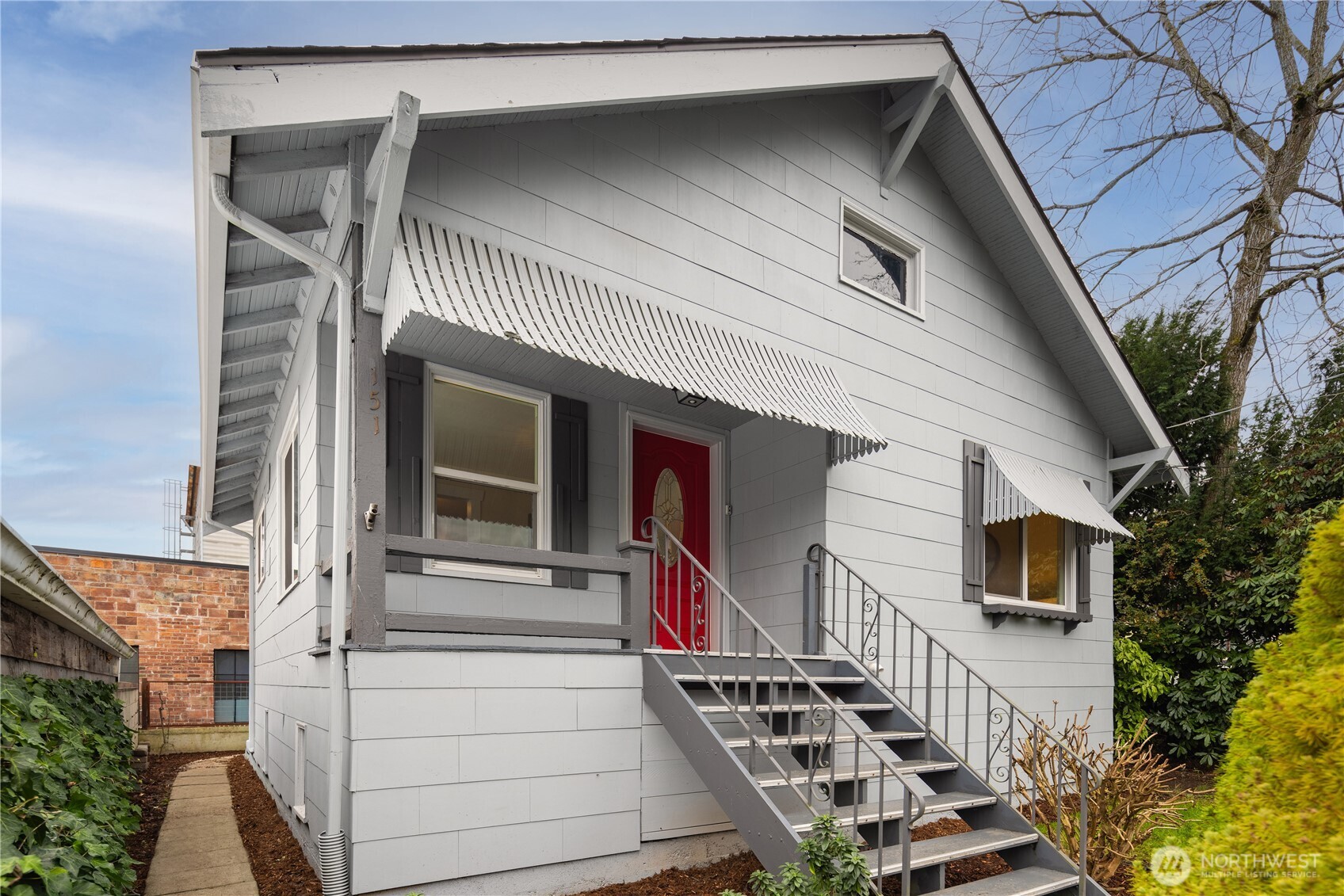 a front view of a house with stairs