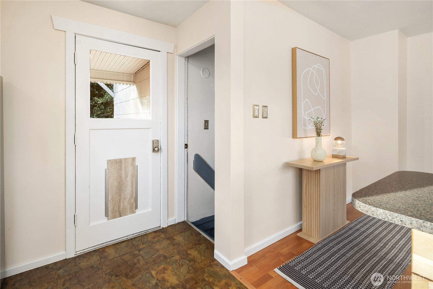 151 North 77th Street Seattle, WA 98103 - Photo 12 of 27 a view of a livingroom with wooden floor and a hallway