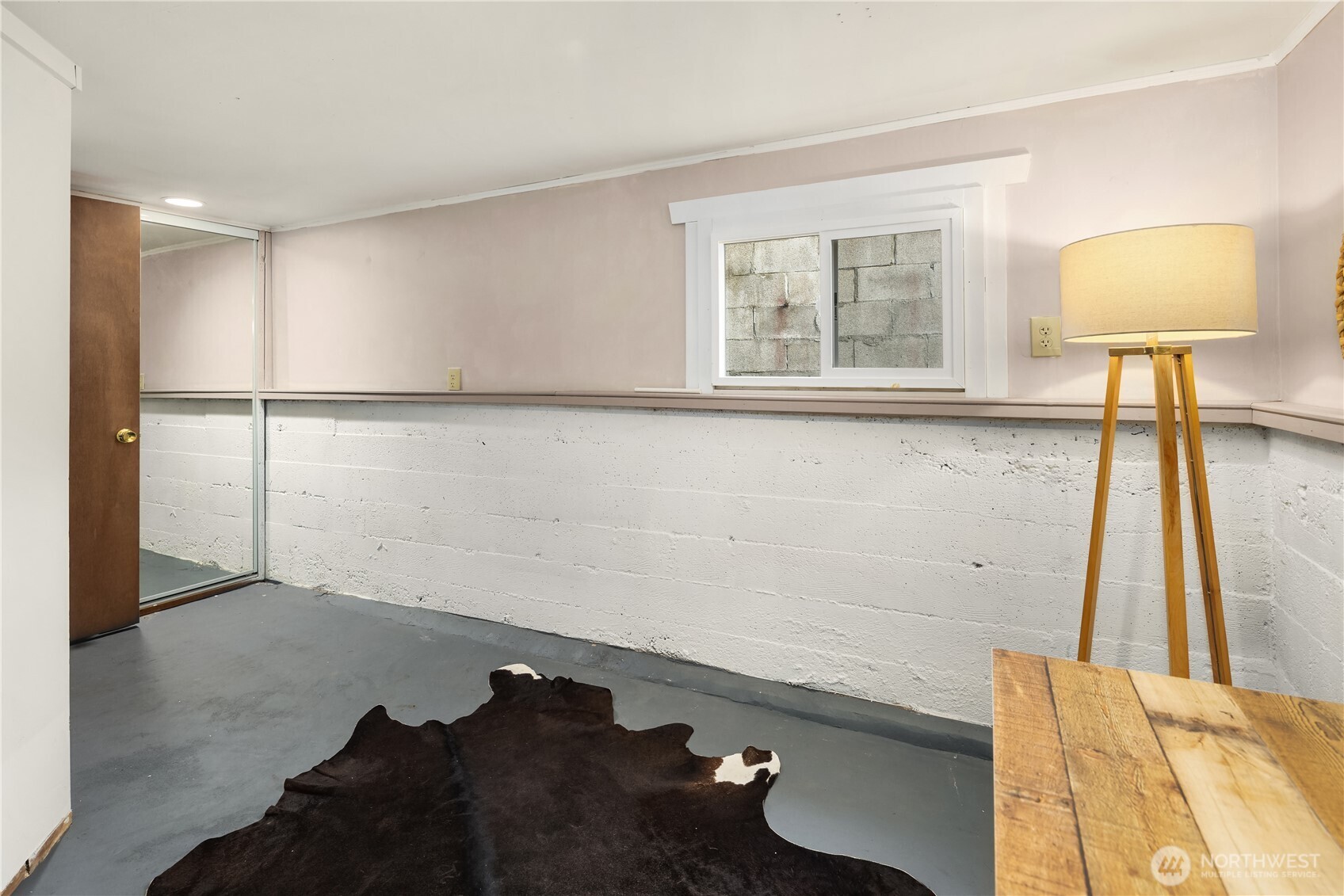 151 North 77th Street Seattle, WA 98103 - Photo 17 of 27 a view of a room with rack on the wall and a potted plant