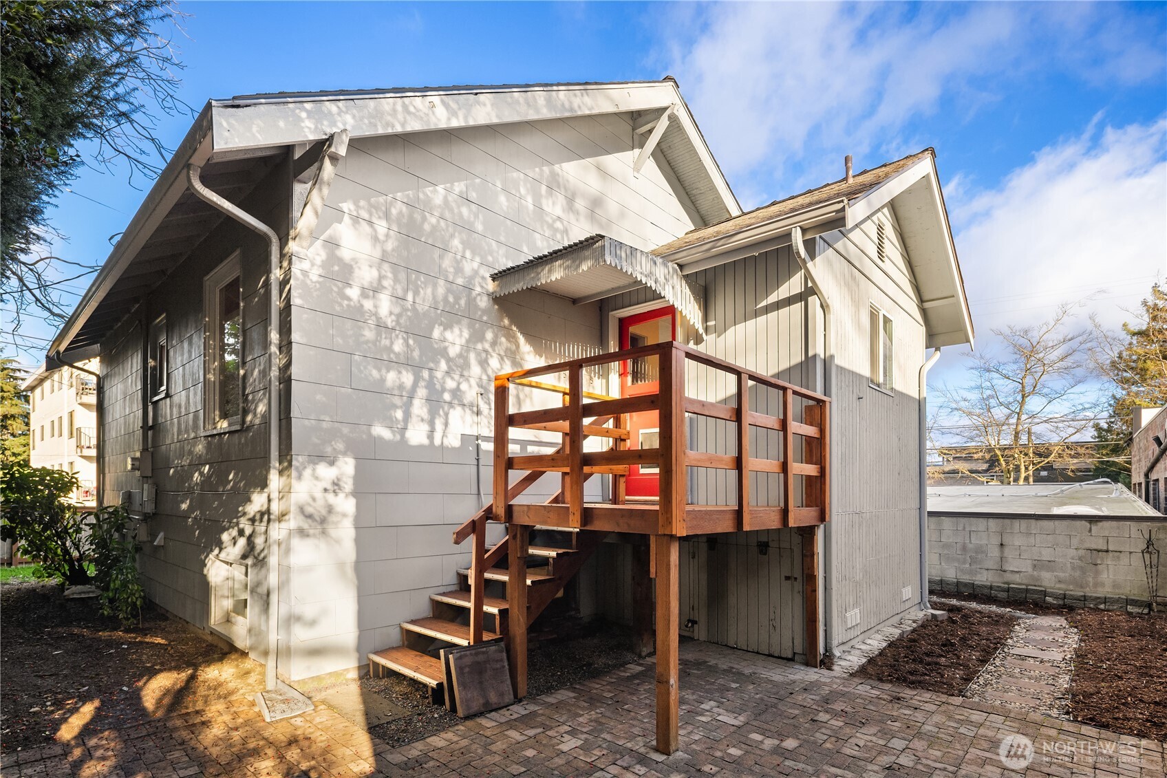151 North 77th Street Seattle, WA 98103 - Photo 22 of 27 a view of a blue house with large windows