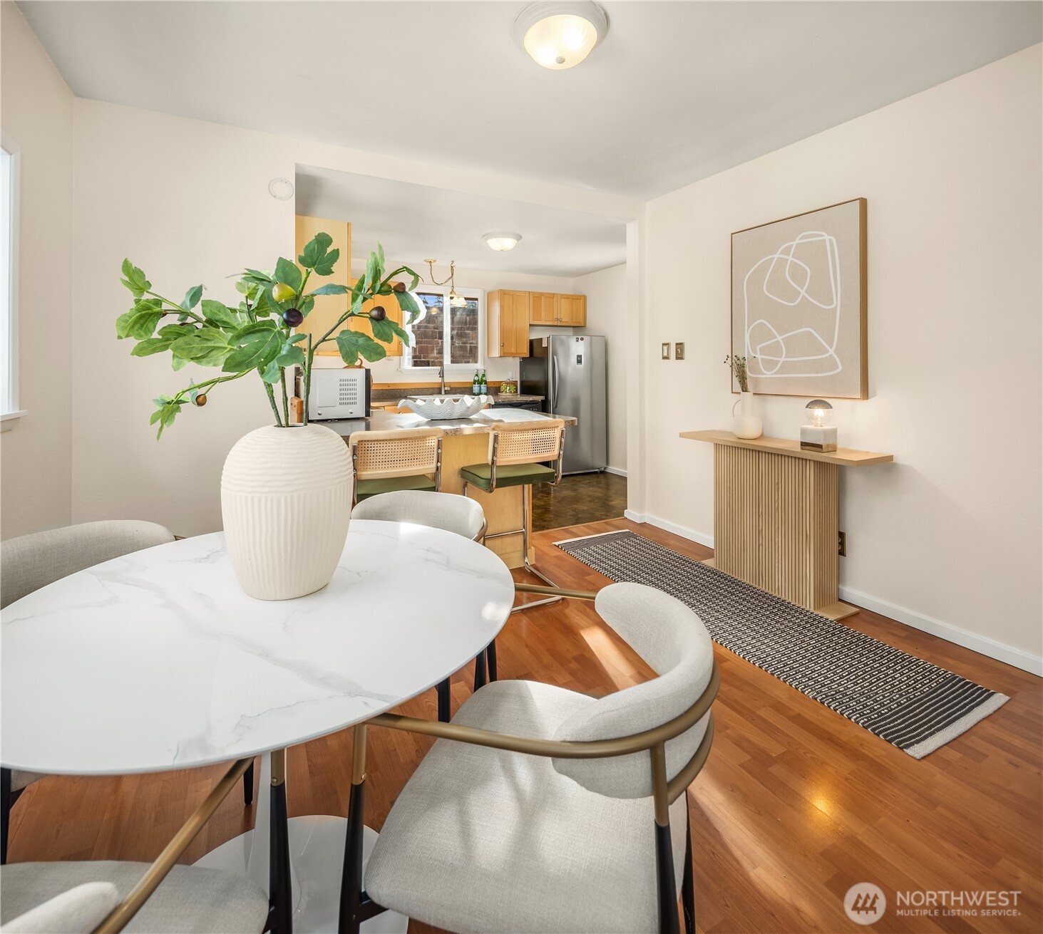 151 North 77th Street Seattle, WA 98103 - Photo 7 of 27 a dining room with furniture and wooden floor