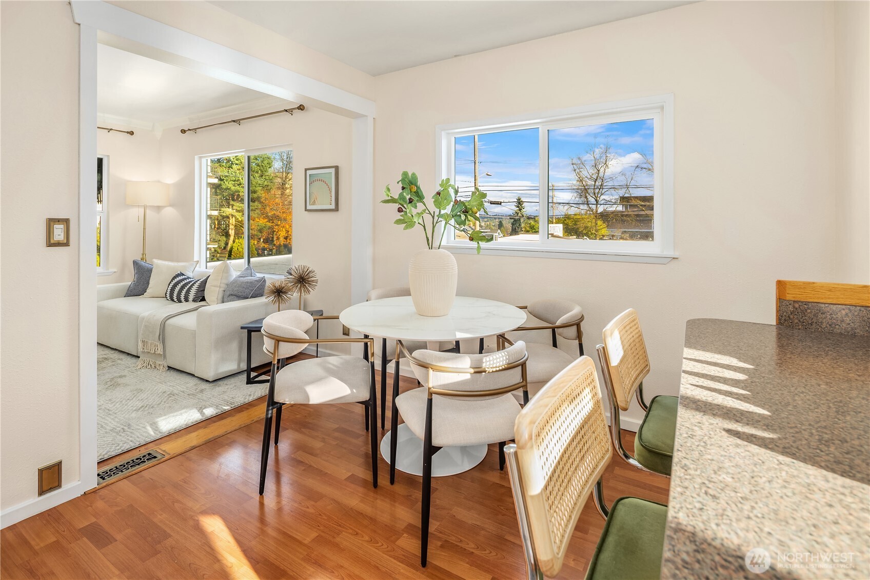 151 North 77th Street Seattle, WA 98103 - Photo 8 of 27 a view of a dining room with furniture a potted plant and wooden floor