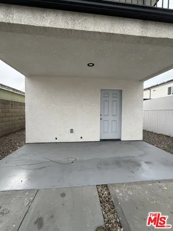 a view of a hallway with white walls