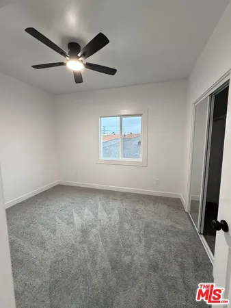 an empty room with a flat screen tv