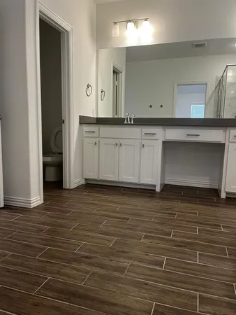 a view of a kitchen with cabinets