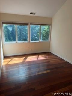 1117 Cedar Ridge Road Oyster Bay, NY 11771 - Photo 11 of 41 an empty room with wooden floor and windows