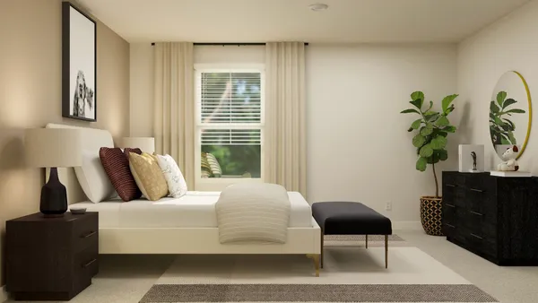a bedroom with a bed lamps and window