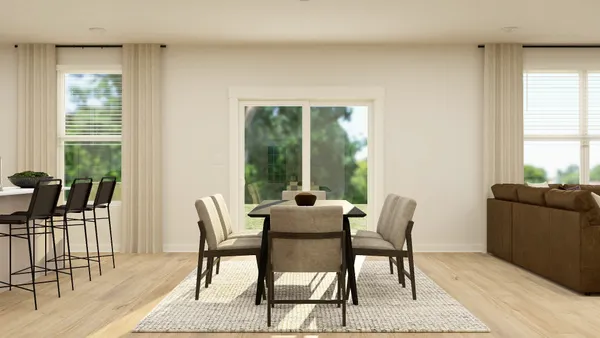 a dining room with furniture and wooden floor