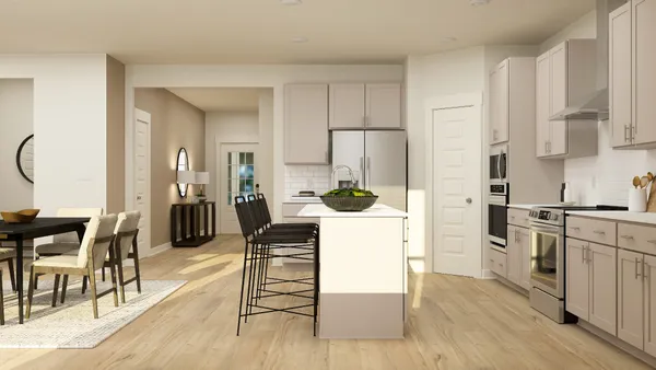 a kitchen with stainless steel appliances kitchen island granite countertop a refrigerator a stove a sink and white cabinets with wooden floor