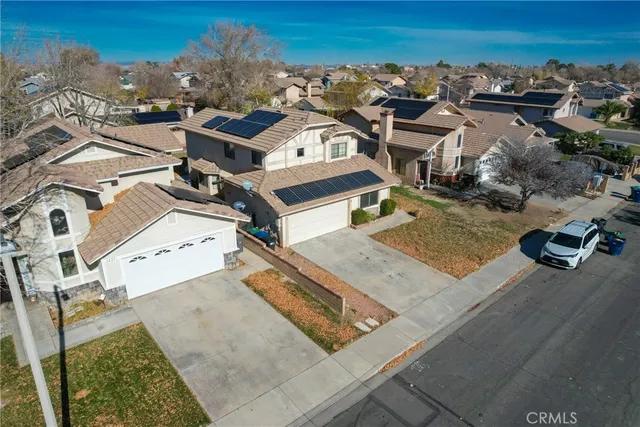 an aerial view of a house with a garden