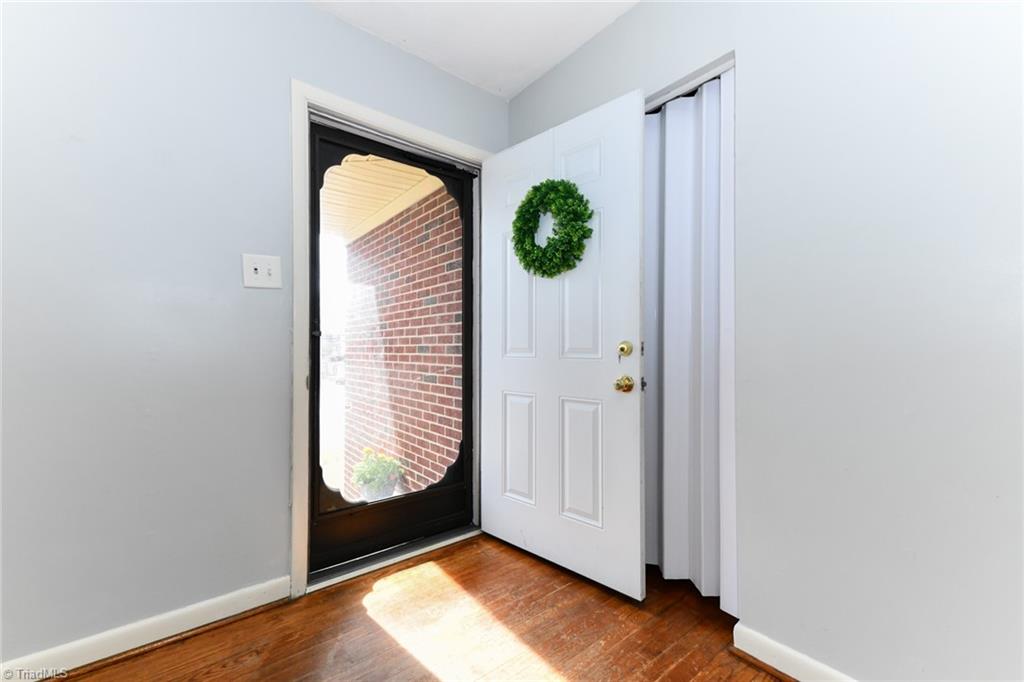 2206 Springhill Road Greensboro, NC 27403 - Photo 5 of 27 Enter into the light filled living room/den
