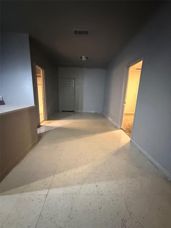 609 Elwayne Avenue Dallas, TX 75217 - Photo 2 of 4 Hallway with baseboards