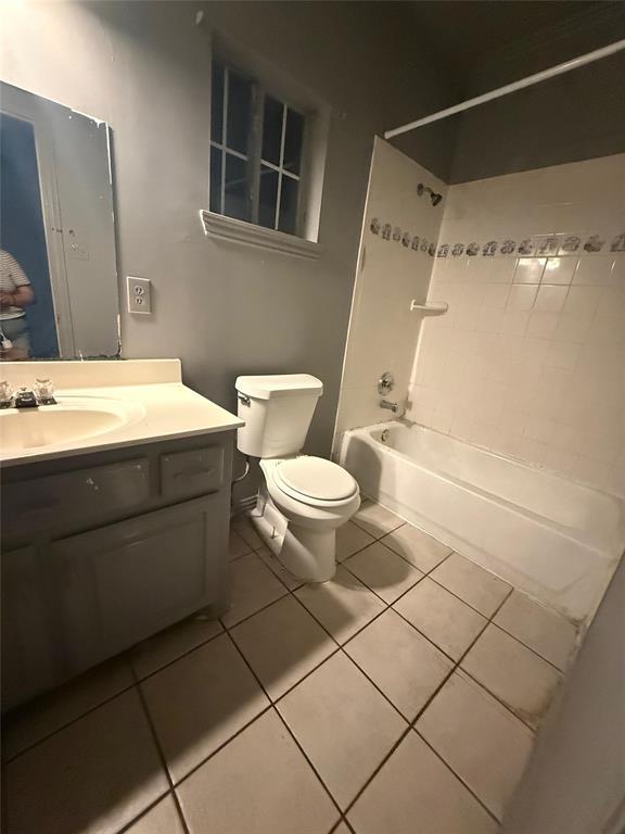 609 Elwayne Avenue Dallas, TX 75217 - Photo 4 of 4 Bathroom featuring tub / shower combination, vanity, and light tile patterned floors