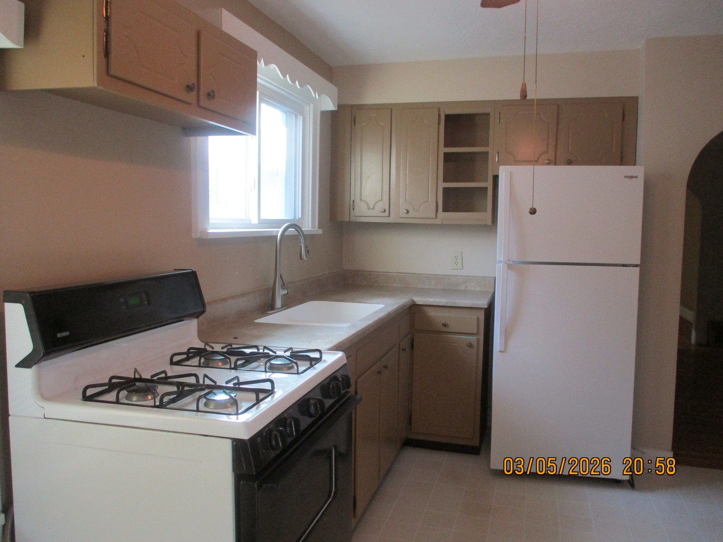 1412 13th Street Moline, IL 61265 - Photo 6 of 31 a kitchen with a stove and a refrigerator