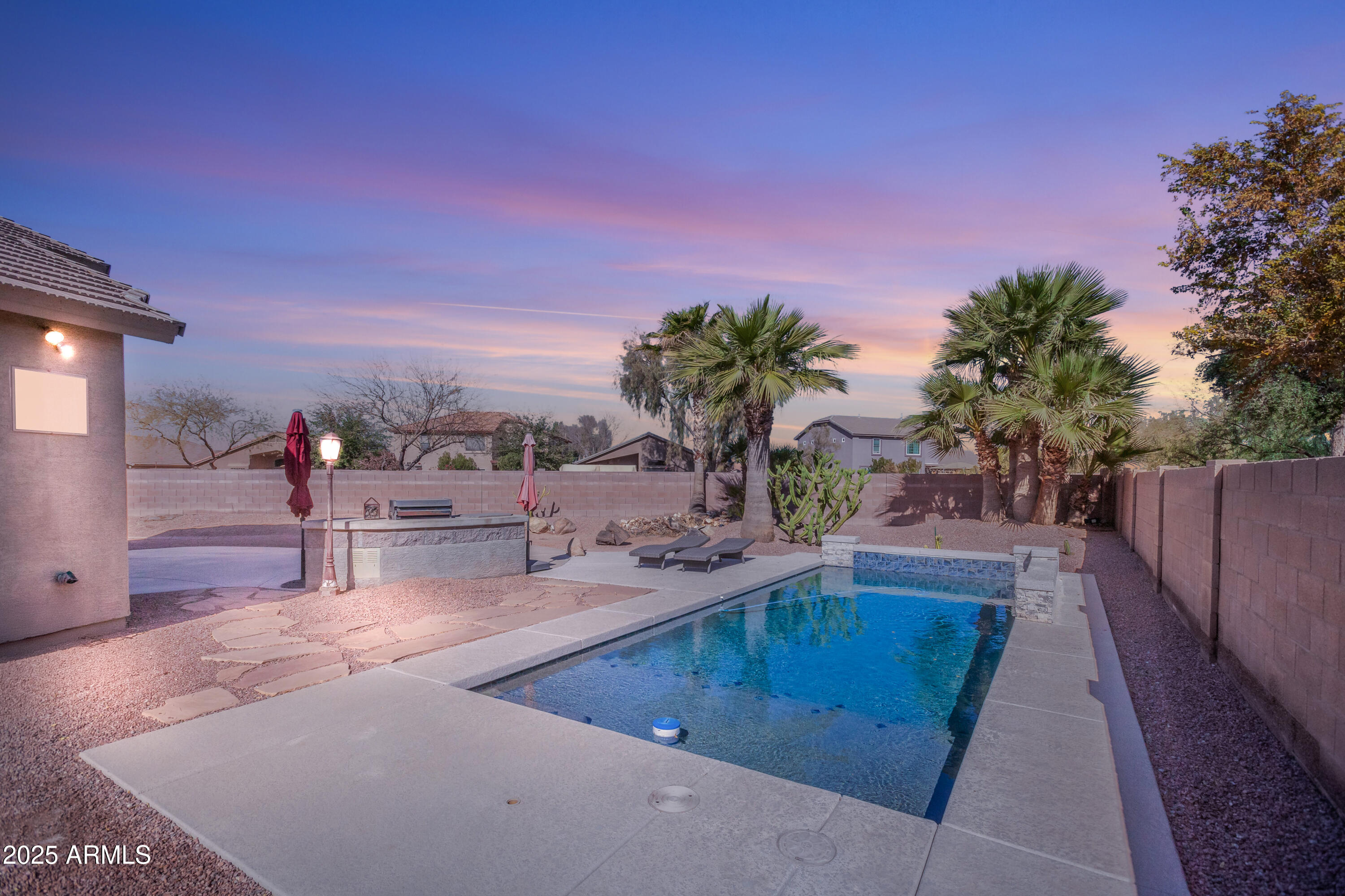43102 West Venture Road Maricopa, AZ 85138 - Photo 4 of 47 Twilight Backyard full pool view (1)