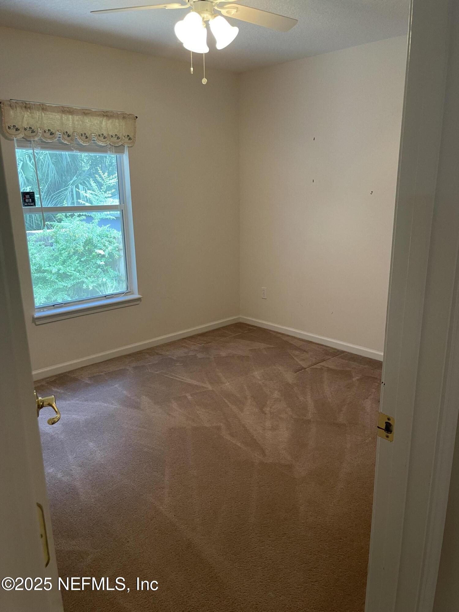 12551 Arrowleaf Lane Jacksonville, FL 32225 - Photo 11 of 14 an empty room with a window