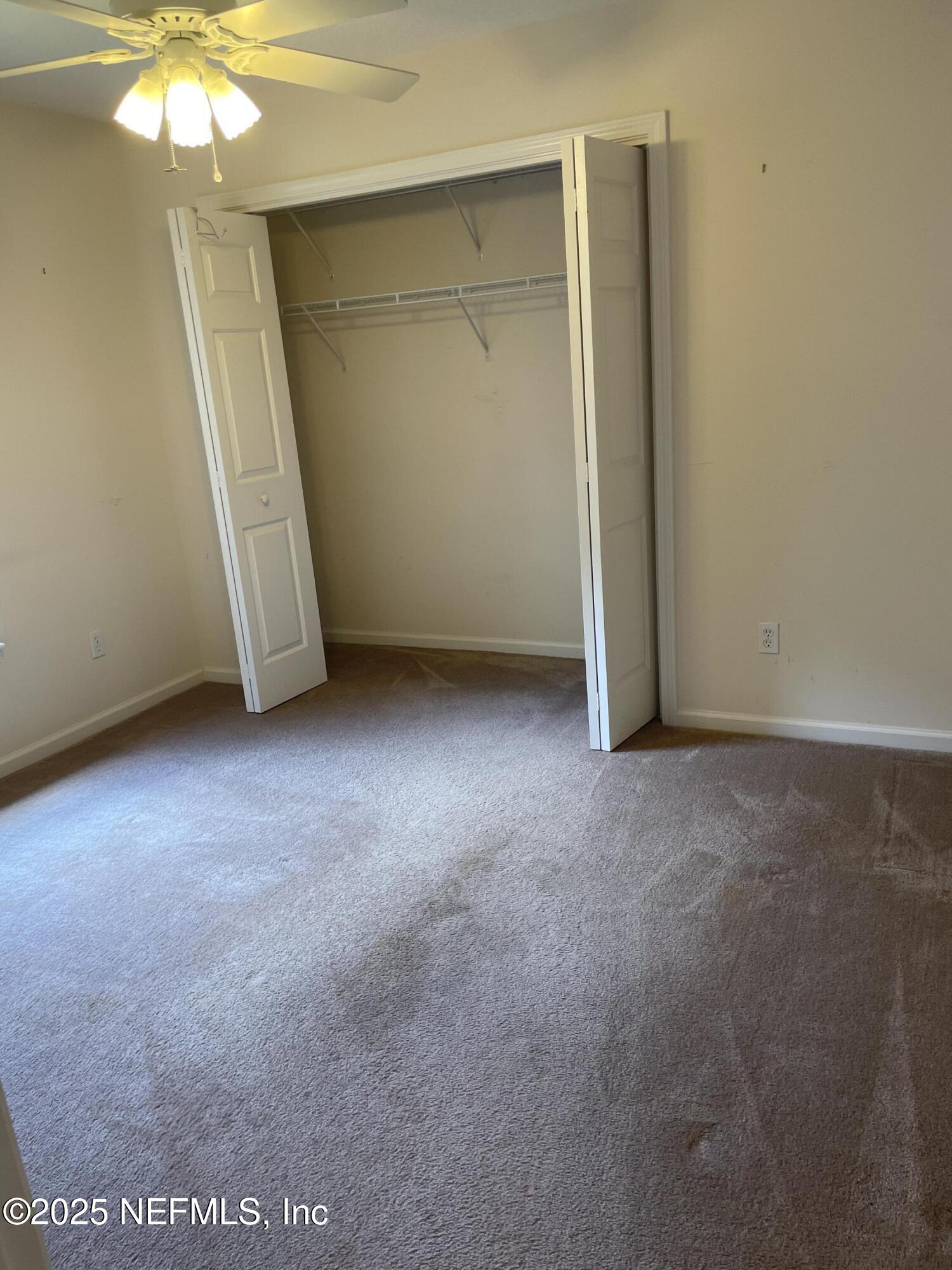 12551 Arrowleaf Lane Jacksonville, FL 32225 - Photo 12 of 14 an empty room with a mirror