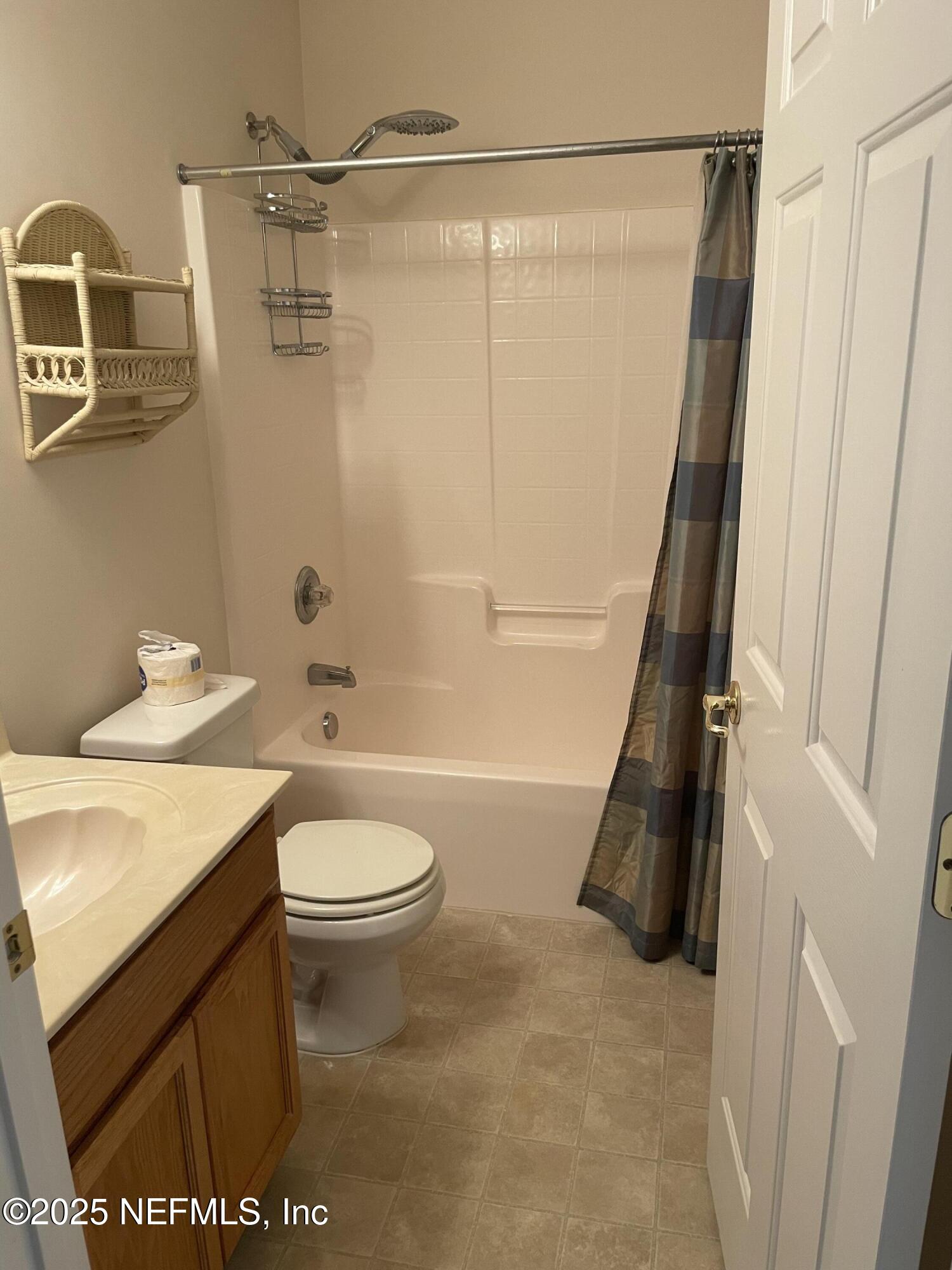 12551 Arrowleaf Lane Jacksonville, FL 32225 - Photo 13 of 14 a bathroom with a sink a toilet and a shower