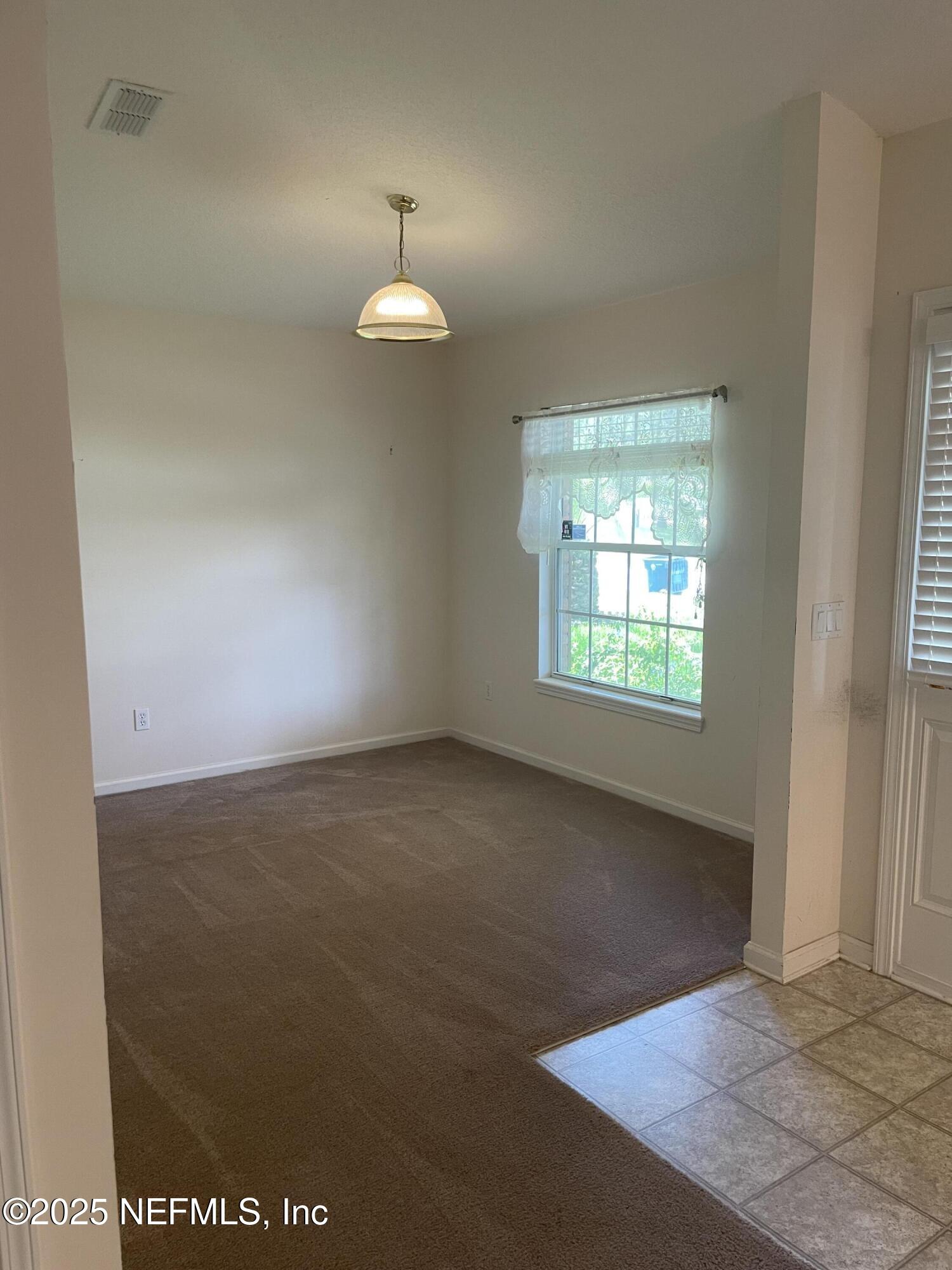12551 Arrowleaf Lane Jacksonville, FL 32225 - Photo 7 of 14 an empty room with a window