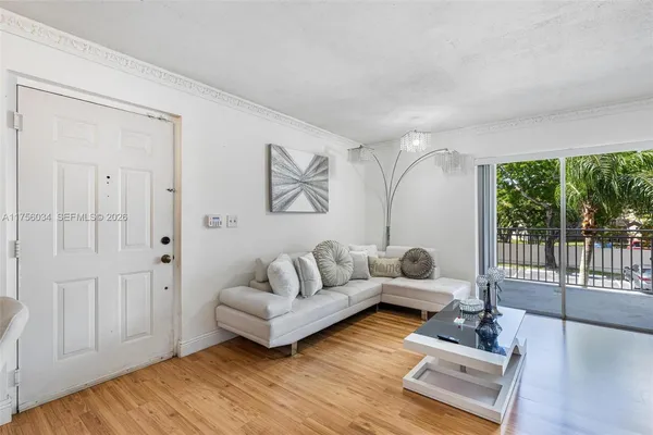 a living room with furniture and a large window