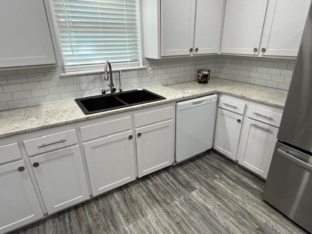 508 North Water Street Roby, TX 79543 - Photo 13 of 40 granite countertop and tile backsplash