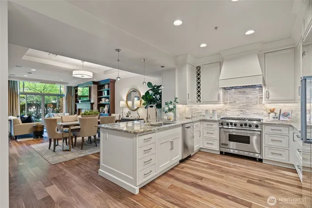 a kitchen with a stove a sink and a refrigerator