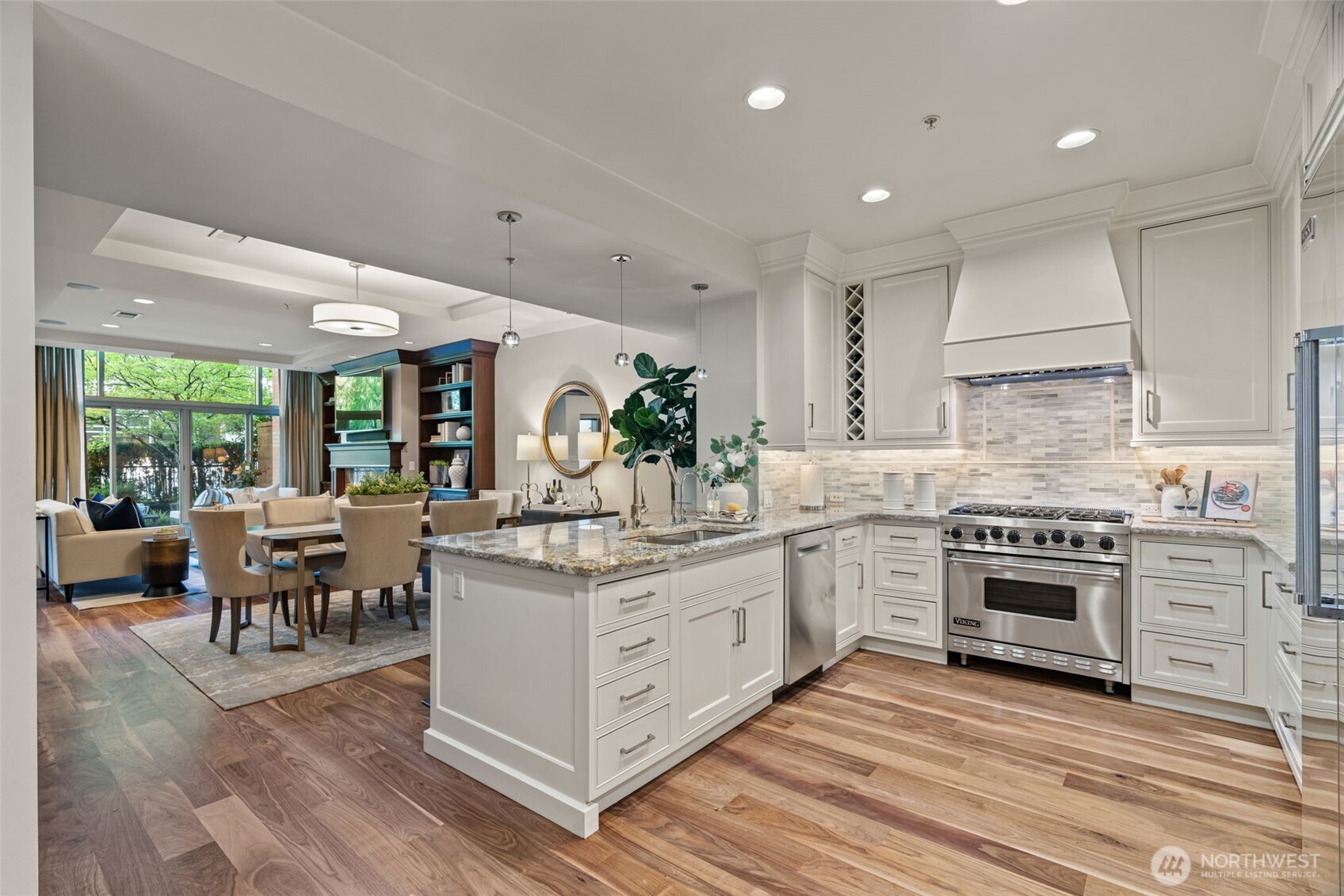 10616 Northeast 9th Place, Unit TH4 Bellevue, WA 98004 - Photo 11 of 39 a kitchen with a stove a sink and a refrigerator