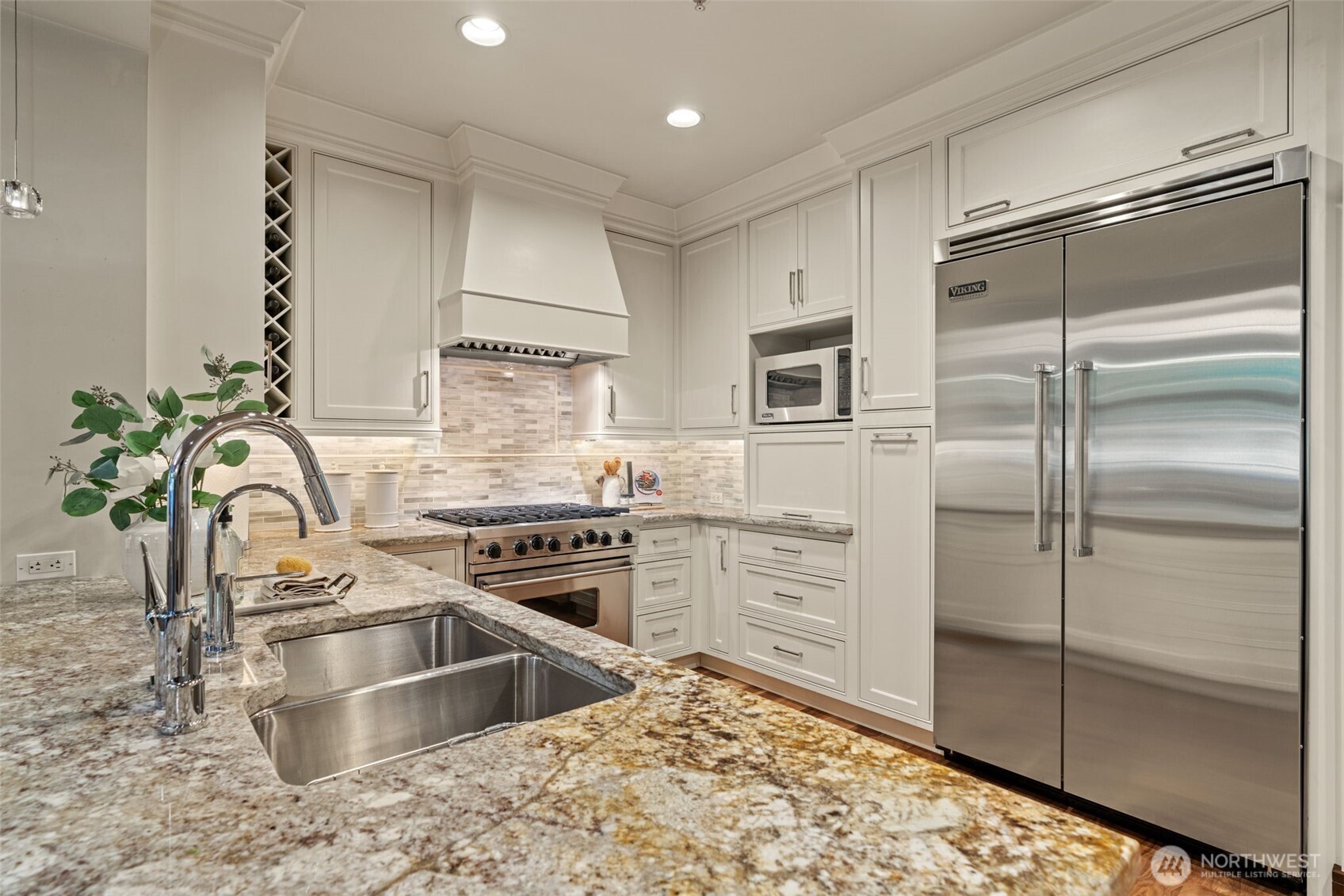 10616 Northeast 9th Place, Unit TH4 Bellevue, WA 98004 - Photo 12 of 39 a kitchen with a refrigerator sink and stove