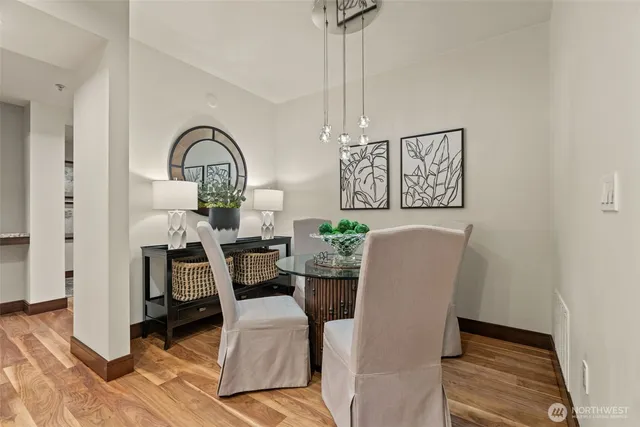 a view of a dining room with furniture window and wooden floor