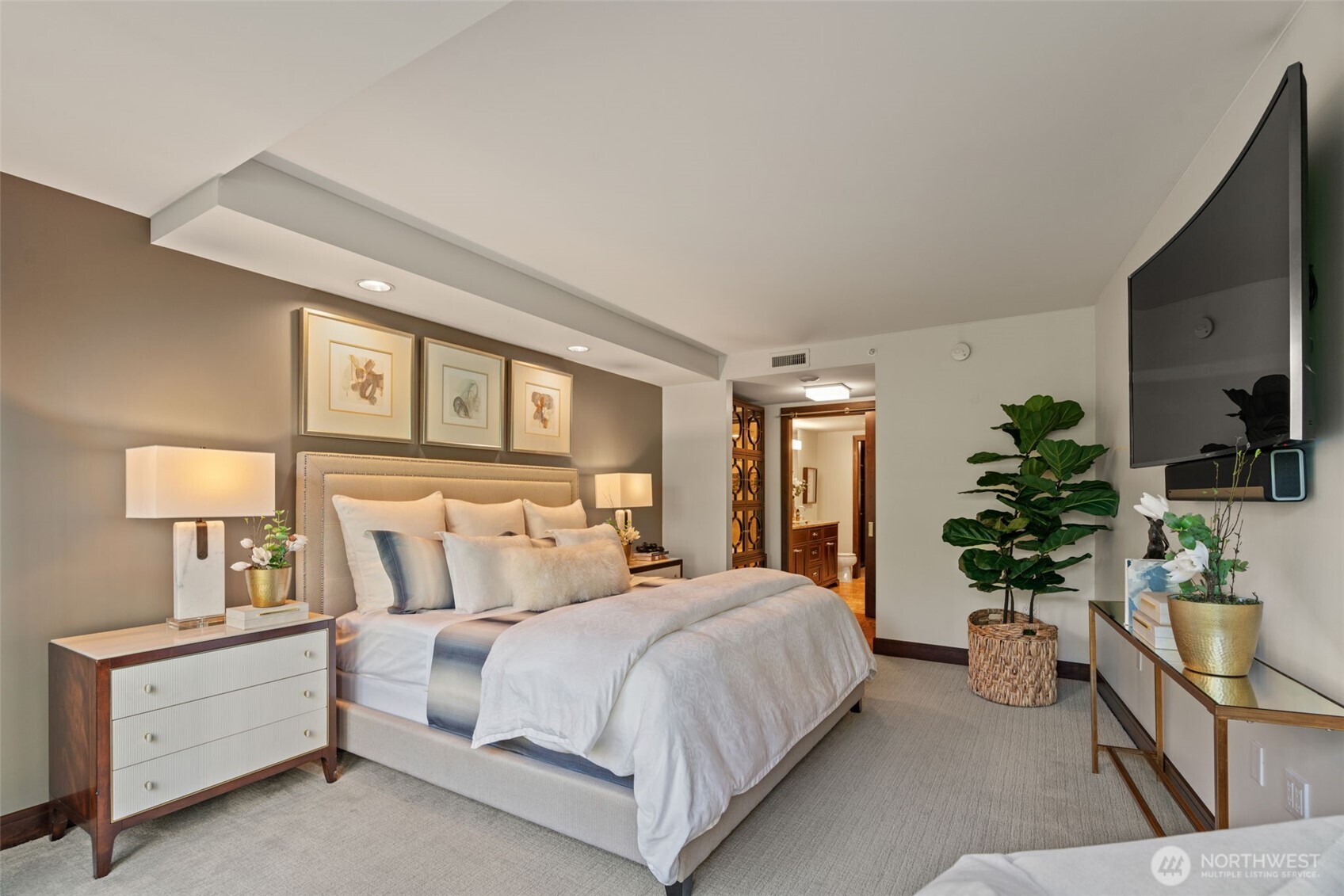 10616 Northeast 9th Place, Unit TH4 Bellevue, WA 98004 - Photo 17 of 39 a bedroom with a large bed and a flat tv screen on dresser