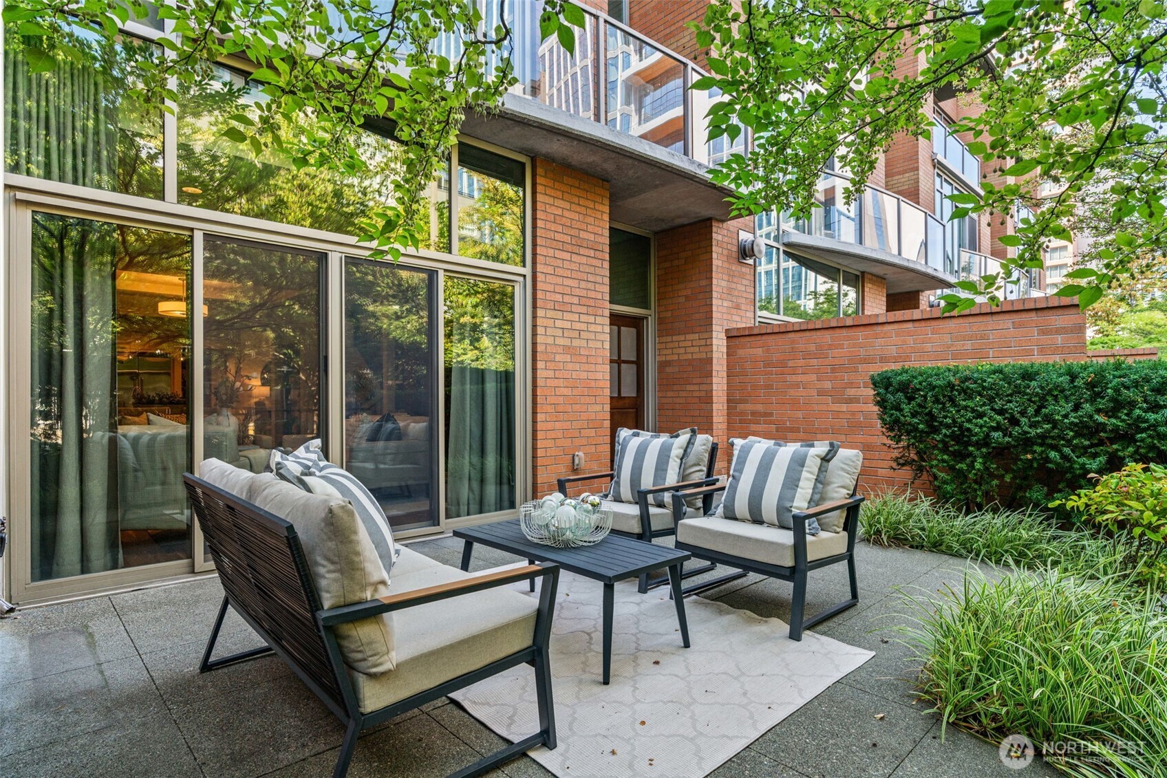 10616 Northeast 9th Place, Unit TH4 Bellevue, WA 98004 - Photo 2 of 39 a view of a patio with a bench