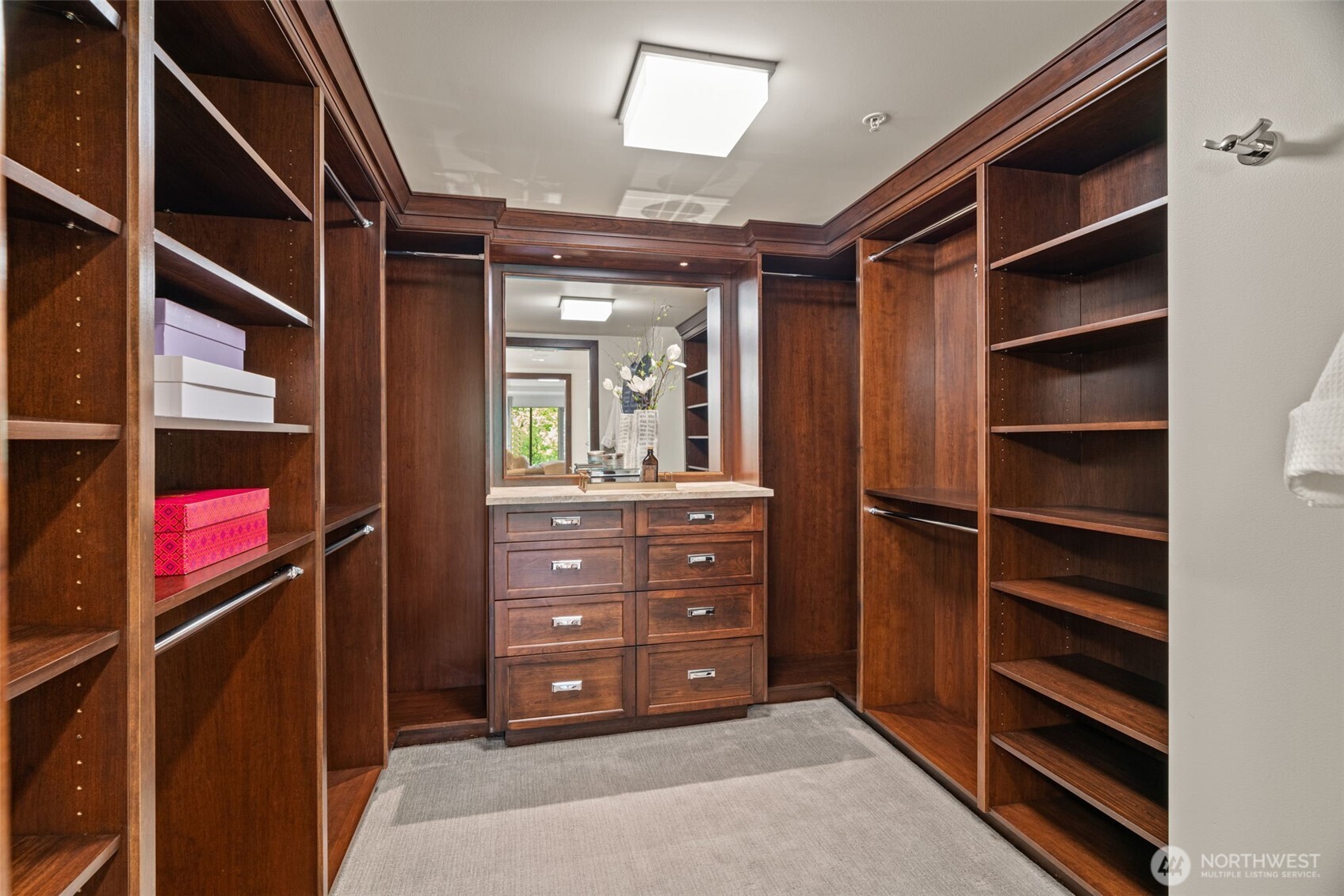 10616 Northeast 9th Place, Unit TH4 Bellevue, WA 98004 - Photo 21 of 39 a view of walk in closet with clothes and shoes