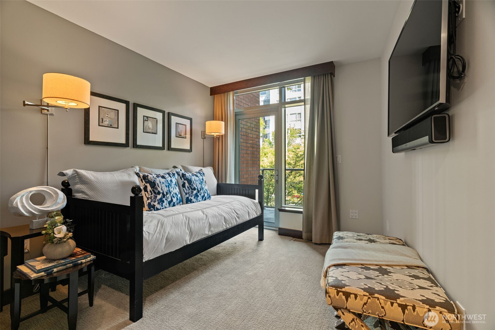 10616 Northeast 9th Place, Unit TH4 Bellevue, WA 98004 - Photo 23 of 39 a bedroom with a bed and wooden floor