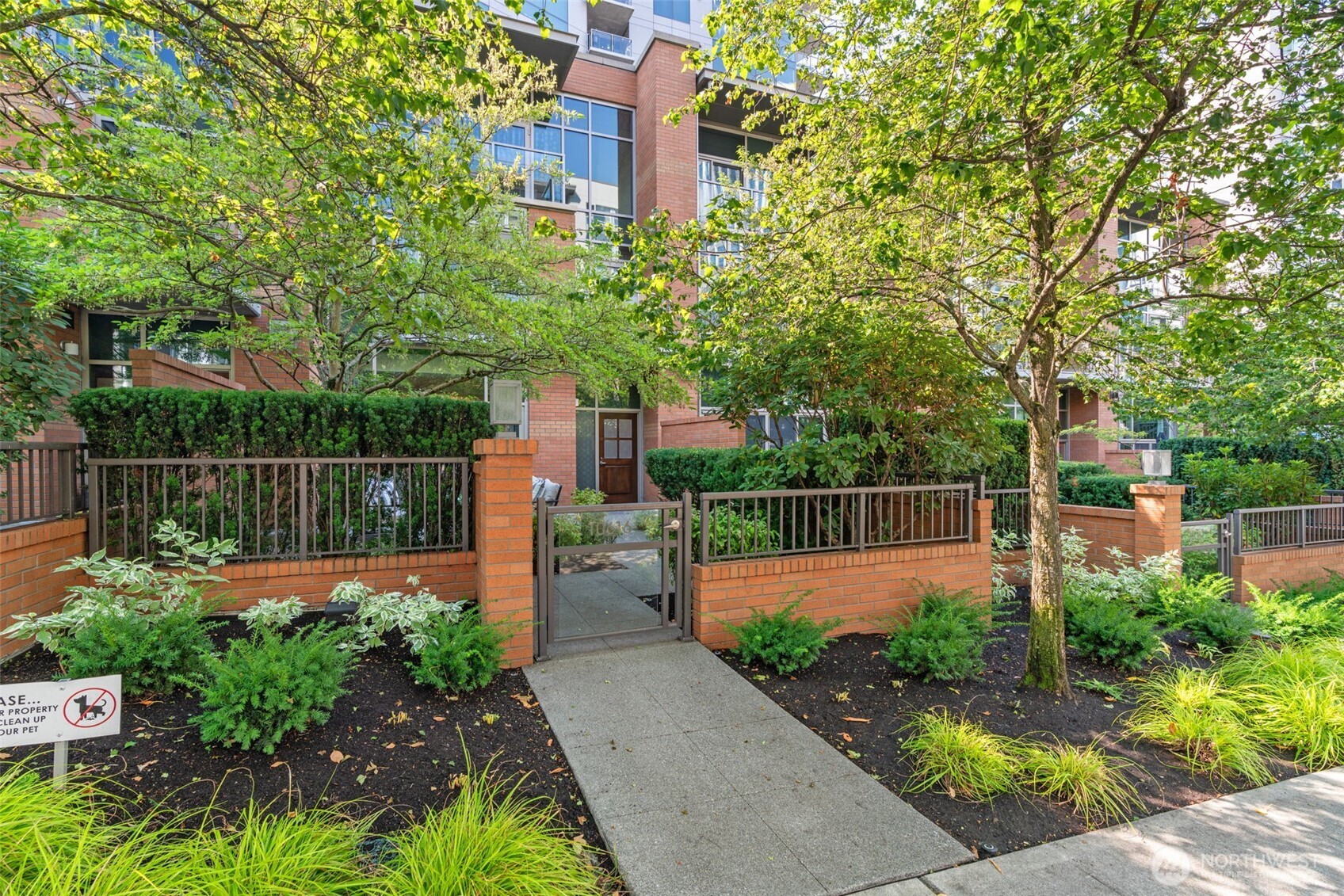 10616 Northeast 9th Place, Unit TH4 Bellevue, WA 98004 - Photo 31 of 39 a garden view with plants