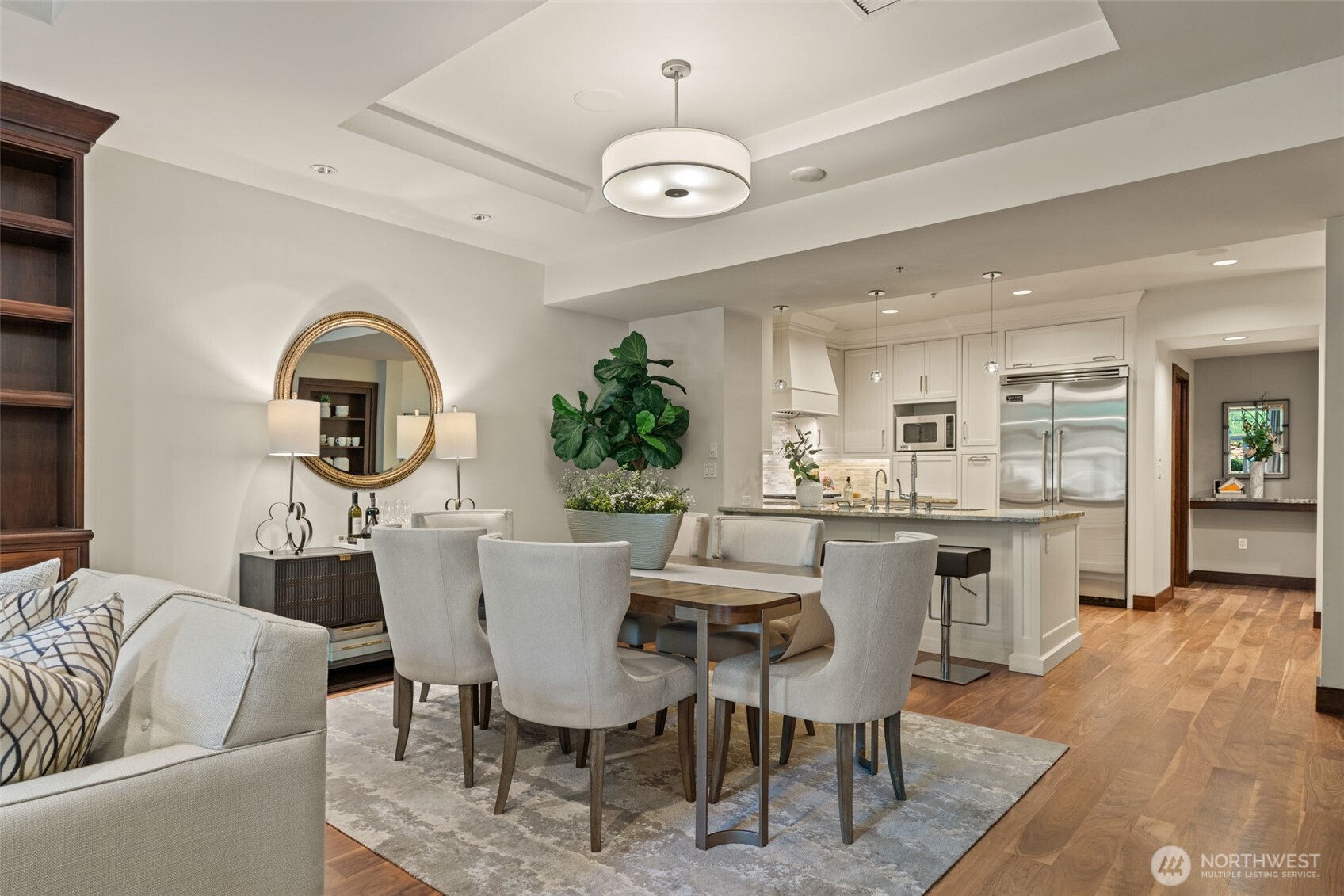 10616 Northeast 9th Place, Unit TH4 Bellevue, WA 98004 - Photo 7 of 39 a view of a dining room with furniture window and wooden floor